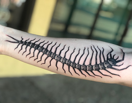 Find addams family tattoo ideas for your next unique tattoo in San Angelo at A1 Tattoos and Piercings