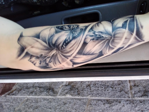 Explore aster flower tattoo ideas, creative tattoo ideas in Pennsboro, available at Juxd Tattoos