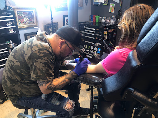 Find arm half sleeve tattoo ideas for your next unique tattoo in Fort Wayne at Grade A Tattoos and Body Piercing