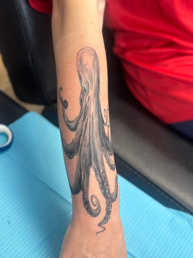 Explore bass fish tattoo ideas, creative tattoo ideas in Whitehall, available at Beachside Tattoos & Smoke Shop