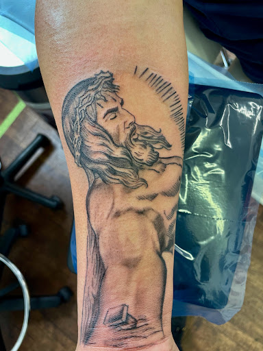 Explore crown tattoo ideas for guys, creative tattoo ideas in Rogers, available at Ink Solutions Tattoo