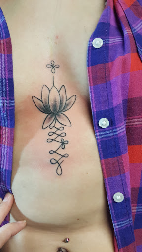 Explore mens ring tattoo ideas, creative tattoo ideas in Monroe, available at Art Haus Ink