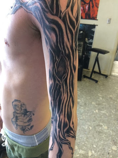 Explore mens inner bicep tattoo ideas, creative tattoo ideas in Muncie, available at The Tattoo Studio