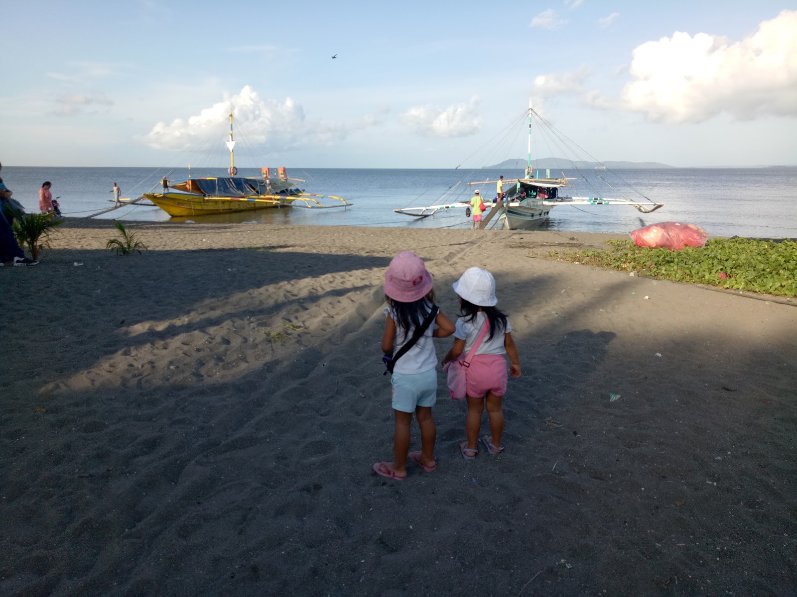 Photo de Paco Beach avec l'eau turquoise de surface