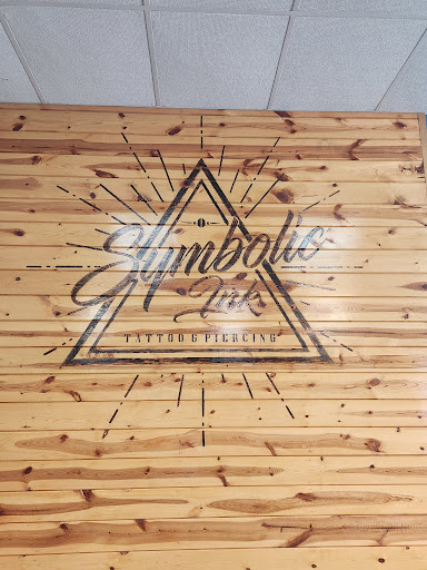 Explore cross hand tattoo ideas, creative tattoo ideas in Foley, available at Symbolic Ink Tattoo Studio