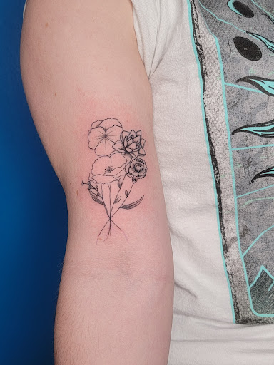 Explore men's back shoulder tattoo ideas, creative tattoo ideas in Columbus, available at Ritual Adornment Tattoo and Piercing