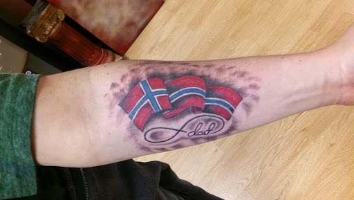 Explore back arm tattoo ideas for guys, creative tattoo ideas in La Crosse, available at La Crosse Tattoo