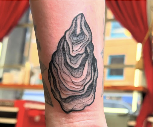 Explore black and grey tattoo filler ideas, creative tattoo ideas in New Orleans, available at Downtown Tattoos and Piercing