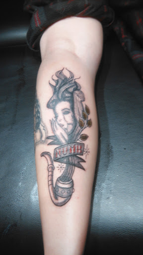 Explore mens neck tattoo ideas, creative tattoo ideas in La Crosse, available at La Crosse Tattoo