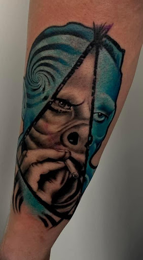 Explore dog print tattoo ideas, creative tattoo ideas in Nashville, available at RedBird Tattoo