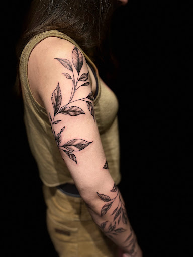 Explore black people tattoo ideas, creative tattoo ideas in Rockland, available at Devoted Visions Ink.