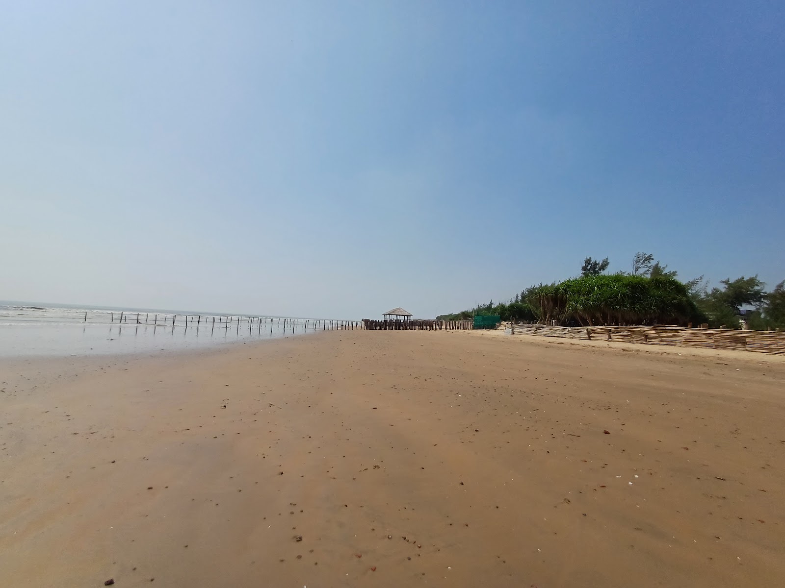 Valokuva Tajpur Sea Beachista. sisältäen pitkä suora
