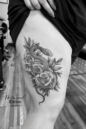 Explore tattoo ideas for the back of the neck, creative tattoo ideas in Nazareth, available at Nocturnal Tattoo