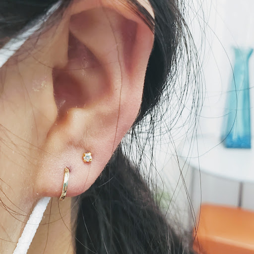 Explore owl tattoo ideas, creative tattoo ideas in Bellevue, available at Just Your Ears Piercing & Permanent Jewelry Studio