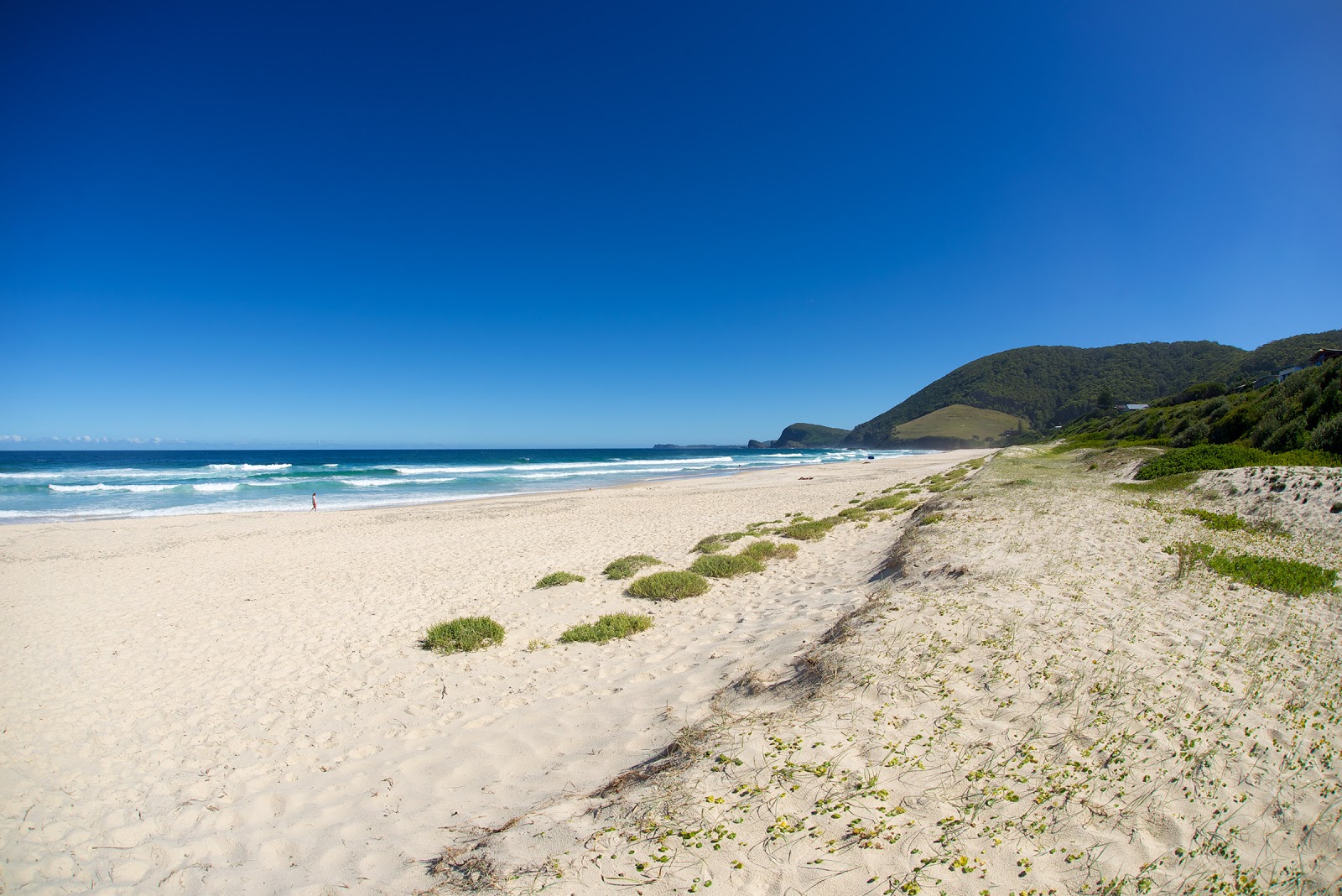 Foto di Blueys Beach sorretto da scogliere