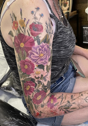 Find small tattoo between breast ideas for your next unique tattoo in Olympia at Sorry Mom Ink Tattoos & Piercings Olympia