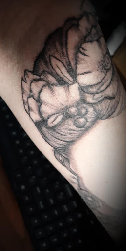 Find tattoo ideas of roses for your next unique tattoo in Arcade at 98 South Tattoo and Piercing