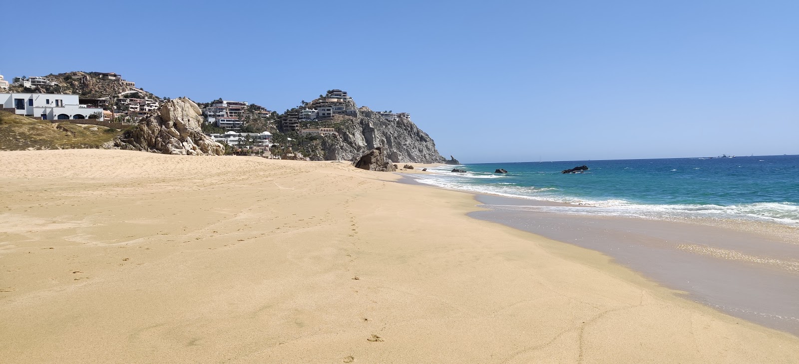 Foto de Pedregal Playa con arena fina beige superficie