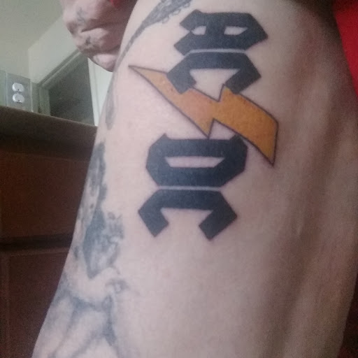 Explore police officer tattoo ideas, creative tattoo ideas in Denver, available at Deeds Of The Flesh Tattoo