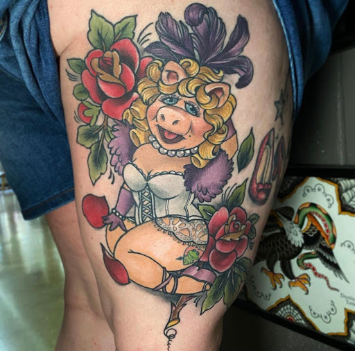 Explore cover up tattoo ideas on thigh, creative tattoo ideas in Indianapolis, available at Great Day Tattoo