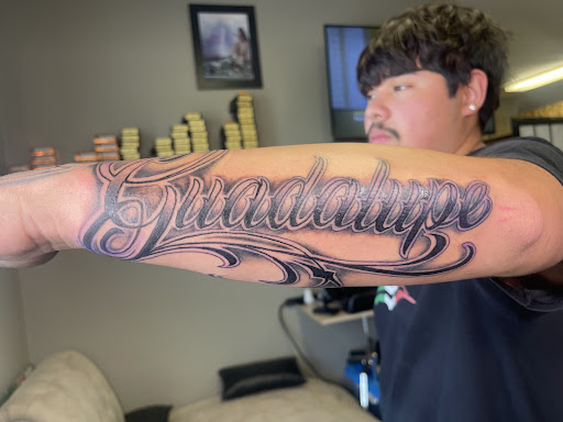 Explore dog collar tattoo ideas, creative tattoo ideas in Watford City, available at Soulful Ink Studios