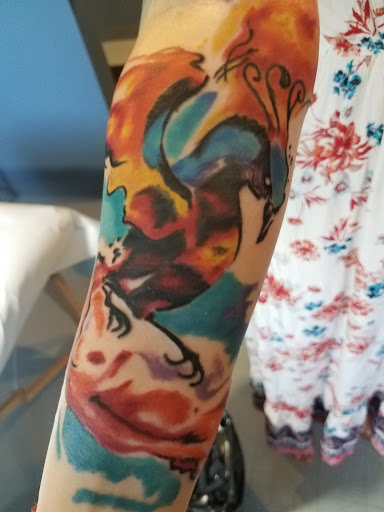 Explore butterfly and rose tattoo ideas, creative tattoo ideas in Spencer, available at Inkorporated Body Art