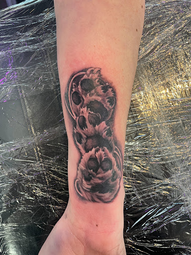 Explore unique knee tattoo ideas, creative tattoo ideas in Logan, available at Surreal Ink Tattoo & Body Piercing