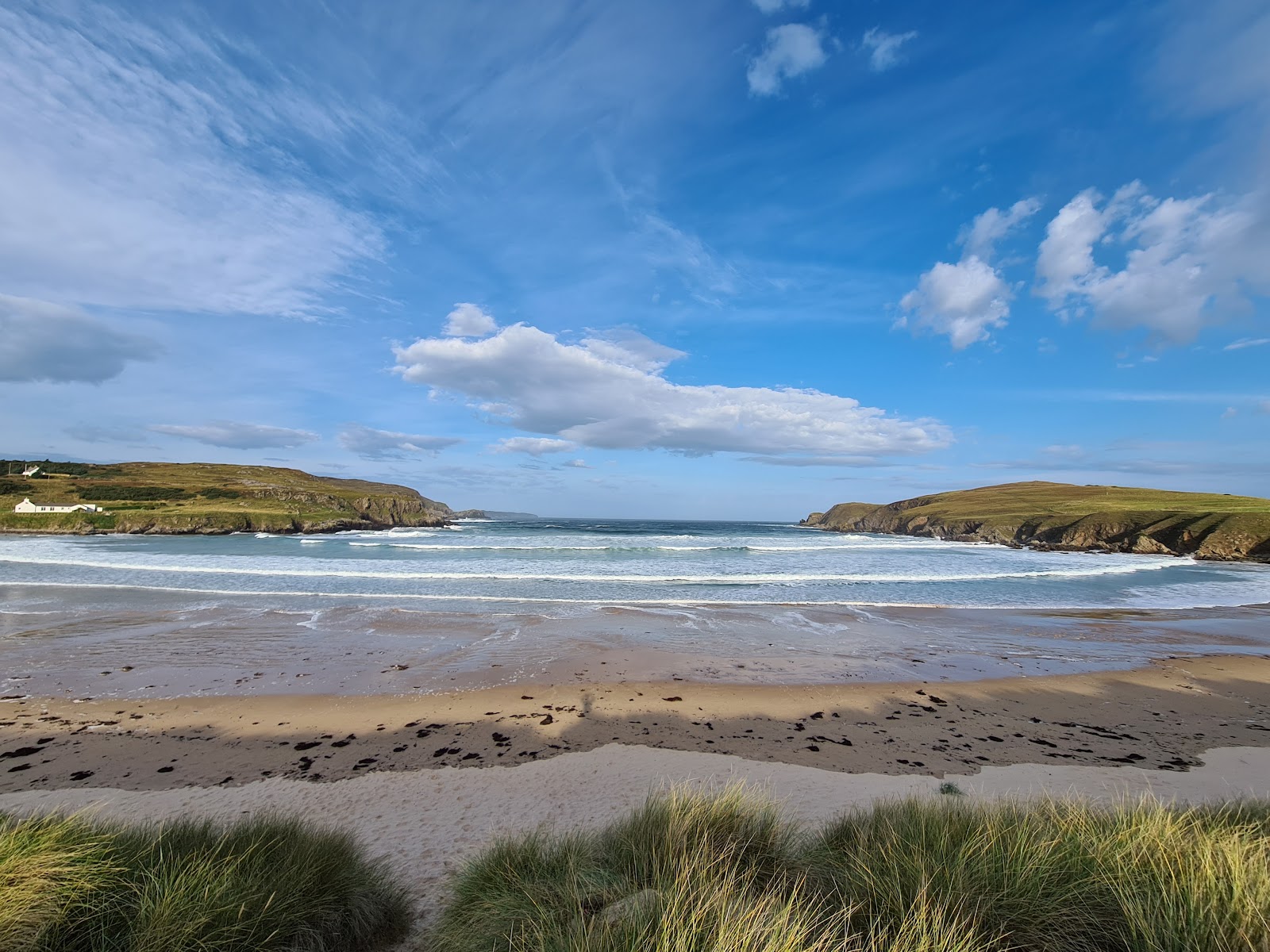 Photo of Farr Beach with turquoise pure water surface