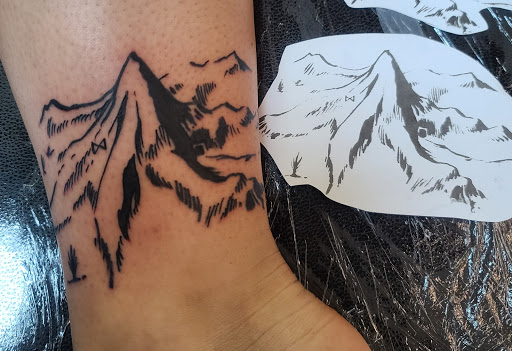 Explore rose tattoo ideas for guys, creative tattoo ideas in Powell, available at AVALON COVE TATTOO