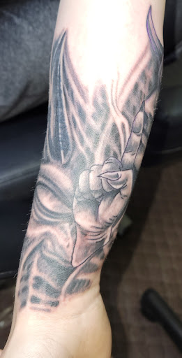 Explore hunger games tattoo ideas, creative tattoo ideas in Angola, available at Hoodlum Ink