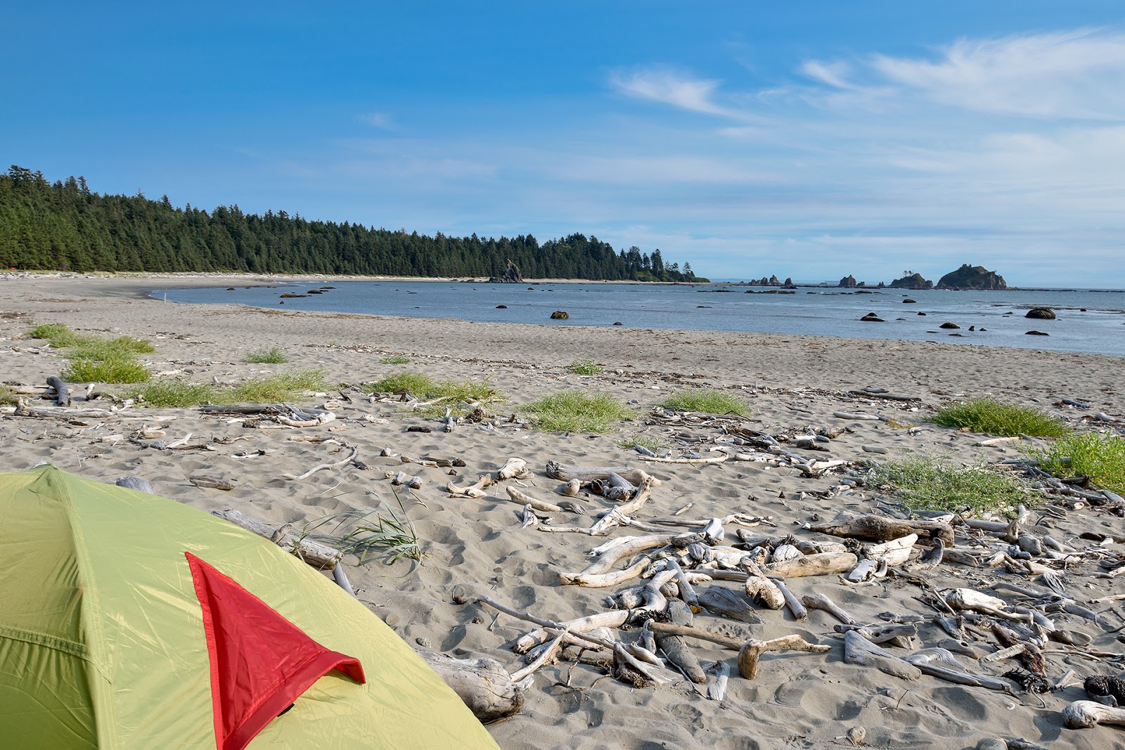 Photo of Strawberry Point with bright sand & rocks surface