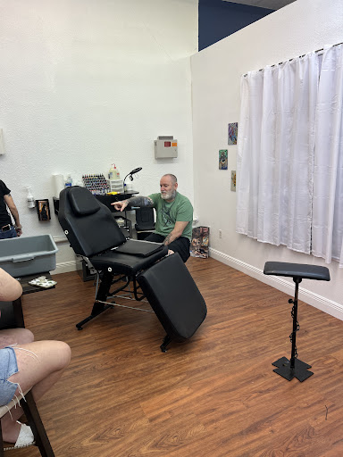 Explore film tattoo ideas, creative tattoo ideas in Cocoa, available at Rorschach Tattoo Shop and Piercing Studio