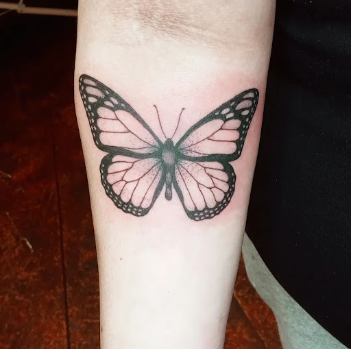 Explore flower back tattoo ideas, creative tattoo ideas in Salem, available at High Priestess Piercing & Tattoo