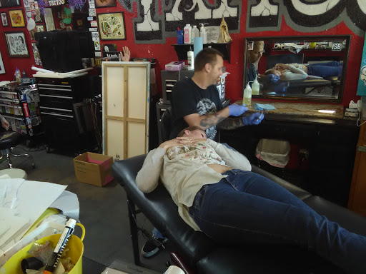 Explore skull sleeve tattoo ideas, creative tattoo ideas in Carmichael, available at Fat Cat Tattoo Parlour