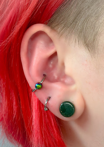 Explore hand tattoo ideas men, creative tattoo ideas in Springfield, available at Body Piercing By Qui Qui