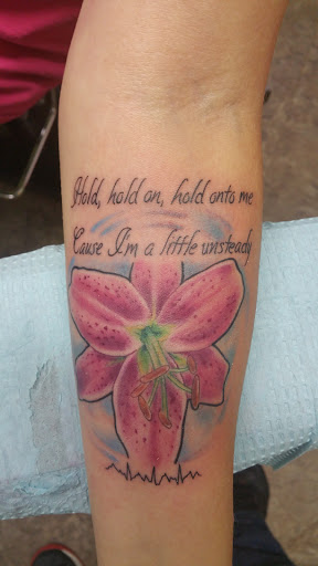 Explore top of hand tattoo ideas, creative tattoo ideas in Storm Lake, available at Alley Cat Tattoo