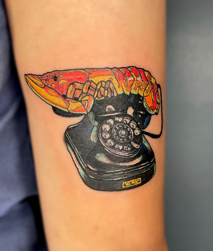 Explore red and black tattoo ideas, creative tattoo ideas in Broxton, available at Seratonin Tattoo Parlor