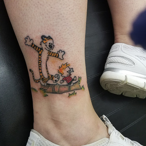 Explore leg tattoo ideas for women, creative tattoo ideas in Lansing, available at Ink & Needle West