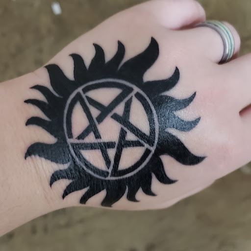 Explore surrender tattoo ideas, creative tattoo ideas in Olympia, available at Lo and Behold Tattoo