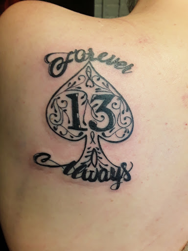 Explore middle of boob tattoo ideas, creative tattoo ideas in Cumberland, available at Queen City Ink