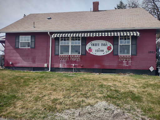 Explore cover up tattoo ideas lower back, creative tattoo ideas in Spokane, available at Sweet Inks & Cool Peeps