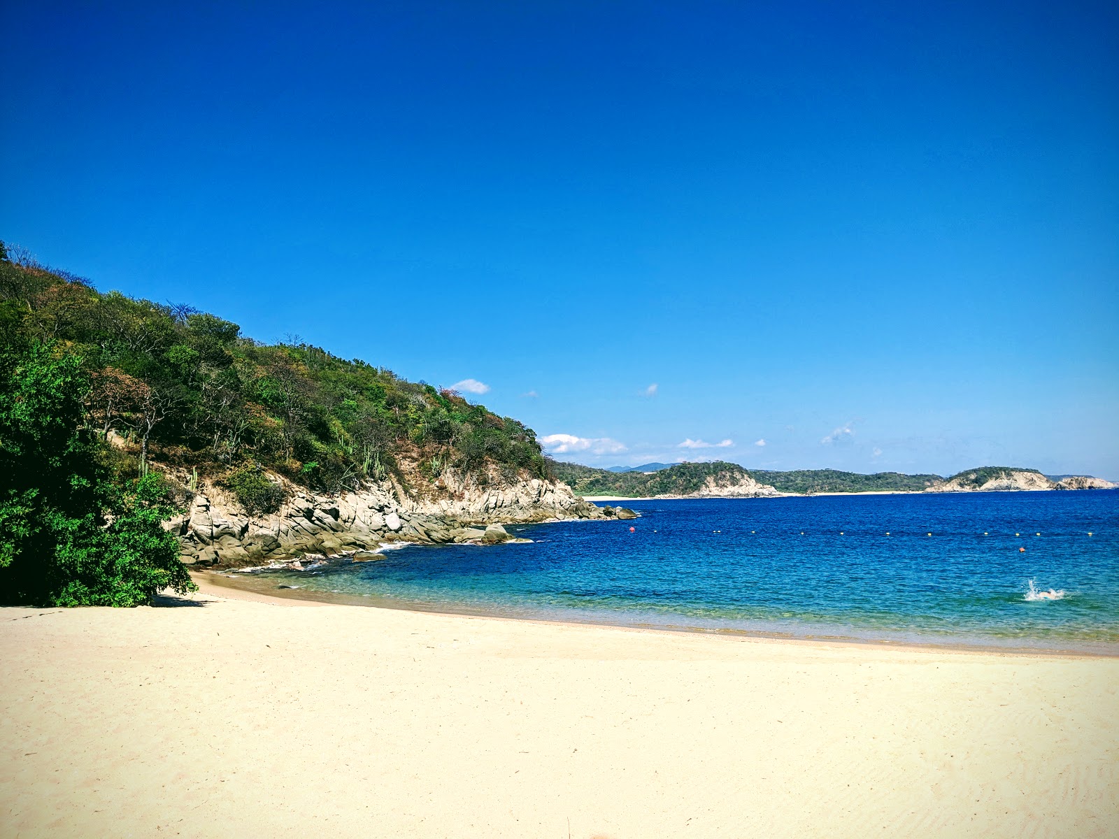 Photo of Tejoncito beach with turquoise pure water surface