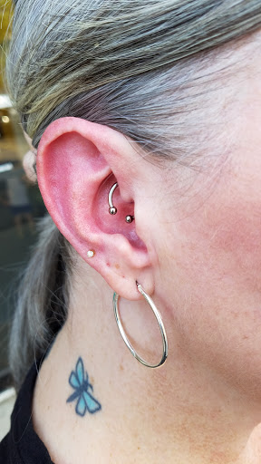 Explore book dragon tattoo ideas, creative tattoo ideas in Troy, available at Bz Ink Tattoo and Piercing Shop