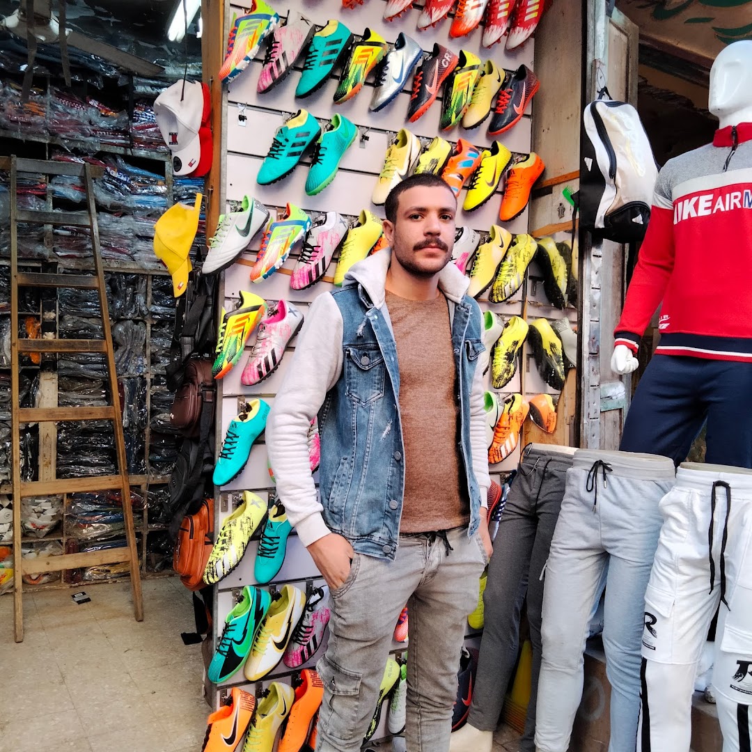 Abu Hamda shops for clothes sports