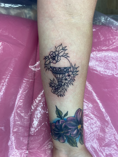 Explore athlete tattoo ideas, creative tattoo ideas in Lake City, available at Crooked Spines Tattoo Studio