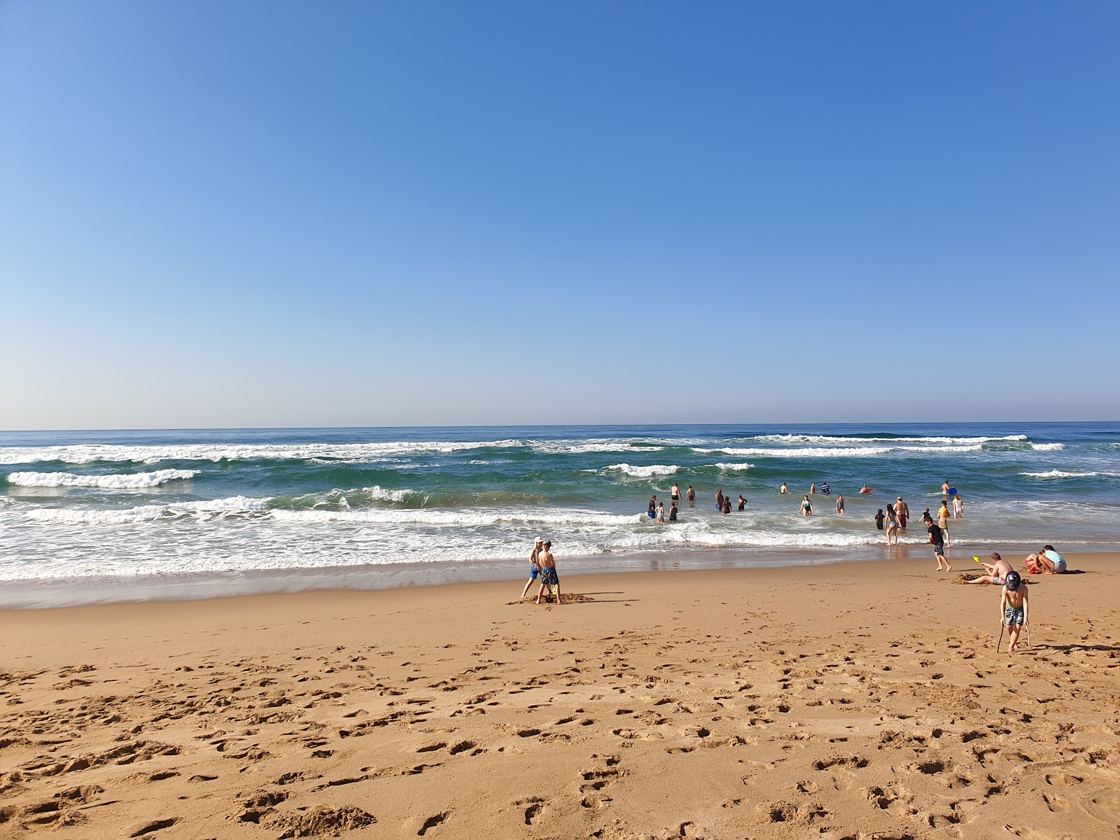 Foto van Illovo Beach met blauw water oppervlakte