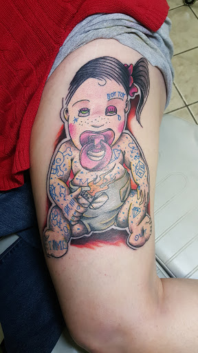 Explore kiss lip tattoo ideas, creative tattoo ideas in Newport, available at Mutiny Tattoo Co. LLC