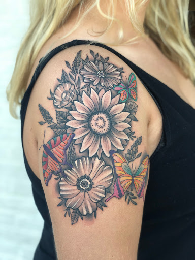 Explore skull tattoo sleeve ideas, creative tattoo ideas in Erie, available at Wayward Tattoo Studio