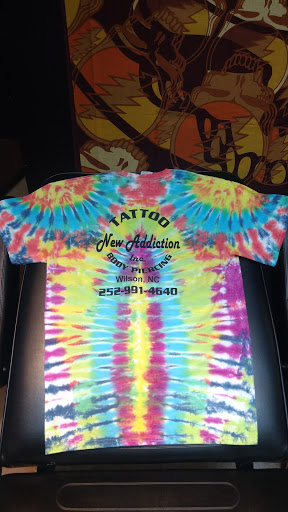 Explore minimalist cat tattoo ideas, creative tattoo ideas in Wilson, available at New Addiction Tattoos