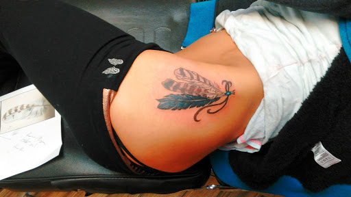 Explore small fish tattoo ideas, creative tattoo ideas in Newport, available at T N T Explosive Tattoo